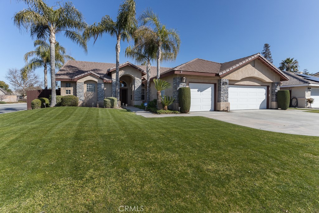 906 Coyote Springs Drive Bakersfield, California Lovely turnkey home with true Pride of Ownership! This semi custom corner lot home with 4 bedroom, 2 bath is situated in the Spring Meadow neighborhood, central to schools, parks, and shopping. Enter the home through custom solid wood double doors with speakeasy viewer grill. The interior features tile flooring throughout, vaulted ceilings, custom 8 foot doors and windows. The kitchen has been updated with granite counter tops, double oven, and stove top. The added pot/pan drawers and large pantry make it great for the chef in the house. With an open floor plan the kitchen and large family room/dining area give plenty of space to relax and entertain. Designed with a split wing floor plan the master bedroom featuring a large master bathroom with new lighting and faucets. The master bedroom offers plenty of privacy with its own access through French doors to the backyard and covered cement patio. The backyard features include maintained landscaping, mature fruit trees along the back including nectarine, orange, Meyer lemon, apple, pear, and pomegranate. Just outside of the kitchen you walk out onto a cement patio for entertaining. Some other additions to the home include Hunter ceiling fans throughout, custom magnetic double screen doors at the entry, new garage doors and motors, and window tinting in bedrooms and great room windows and doors to the backyard.