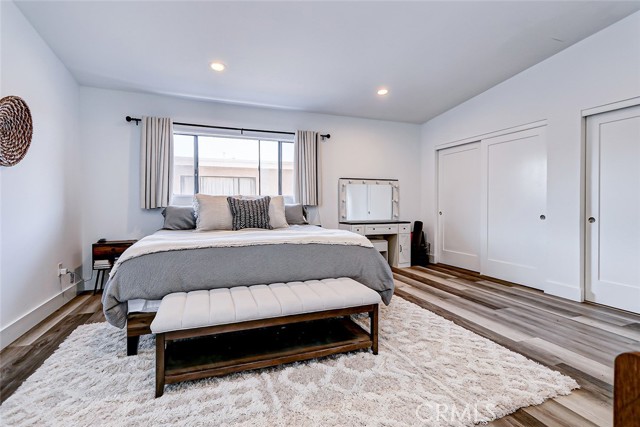 Primary bedroom with vaulted ceilings