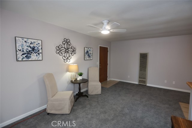 Second unit living room, fresh paint, carpet and ceiling fan