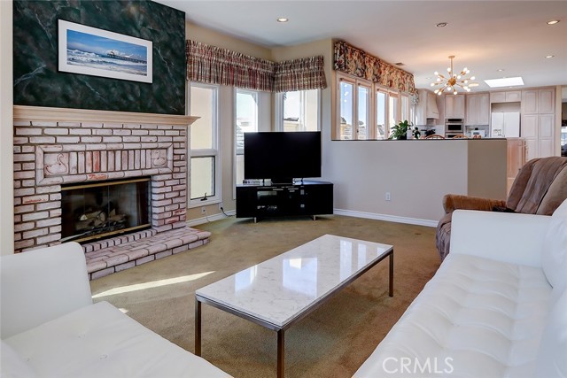 Comfortable family room with custom gas fireplace plus an ocean view looking southwest of PV and Catalina Island