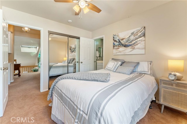 One out of four bedrooms that is set off from a shared full bath. Double pane window, ceiling fan and low pile carpet.