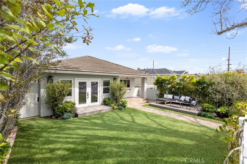 Sitting on the Avenues behind a charming white picket fence, this effortlessly cool beach bungalow with a finished ADU is the ultimate coastal retreat, blending laid-back luxury with classic South Redondo charm. Step inside this thoughtfully designed 3-bedroom, 2-bath home, where open-concept living meets effortless style. The expansive great room seamlessly extends to the outdoors through French doors, filling the space with natural light. The living and dining areas flow together for a spacious yet inviting feel—perfect for everything from cozy nights to entertaining with ease. Outside, the fully turfed front yard and private patio provide the ideal setting for relaxing, dining, or enjoying the fresh coastal air. Practicality meets style in the thoughtfully designed kitchen, combining modern and organic elements with knotty pine ceilings, white cabinetry, and pristine quartz countertops. Premium appliances complete the chef’s dream space, which include sa breakfast nook, walk-in pantry, and a laundry/mudroom with a sink, built-in desk, and outdoor access—ideal for post-beach cleanups or weekly organization. The primary bedroom is a private sanctuary with a walk-in closet, en-suite bath, and direct backyard access. Outside, the reimagined backyard is an entertainer’s dream, with a raised deck, firepit, built-in bench seating, and hanging chairs, all surrounded by lush landscaping. What sets this property apart from all the others lies behind the main house - a beautifully remodeled 2-bedroom ADU with the converted garage offering vaulted ceilings, a kitchenette, and a spacious living room. This ADU is the perfect addition—use it as your private office, guest suite, or extra living space. Plus, it comes with its own private backyard and alley access, making it a prime opportunity for rental income. With a few upgrades, you could transform this space into a top-dollar 2-bedroom, 1-bath rental unit that’s fully outfitted and exceptionally remodeled. Whether you’re seeking additional living space or a steady stream of rental income, this ADU offers endless possibilities. Located moments from the beach, top-rated schools, shopping, and dining, this home offers unbeatable coastal living in a vibrant community that values family, friendship,and a relaxed lifestyle. With income potential from the ADU and a move-in-ready design, this beach bungalow is a rare find in one of Redondo Beach’s mos tcoveted neighborhoods.