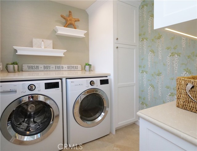 Spacious laundry room with storage and folding area