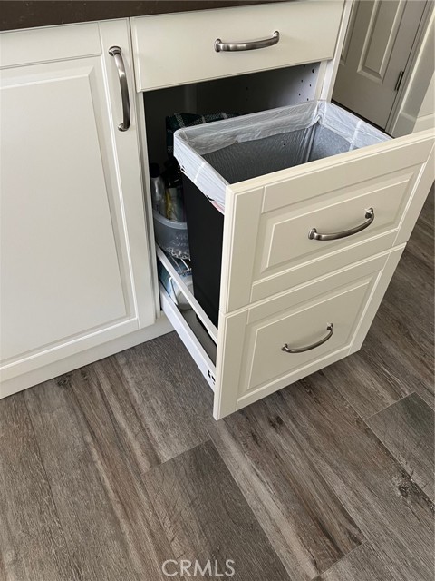 Pull out cabinet for hidden trash and recycle