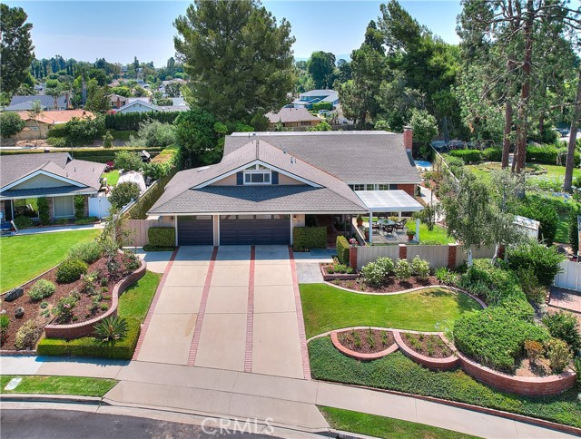 Welcome to this stunning one-owner home in the highly desirable Yorba Linda, CA! This spacious 5-bedroom, 3-bathroom residence spans 2,929 square feet and sits on a generous 14,006 square foot lot.

Step inside to find a large family room, perfect for gatherings, featuring a beautiful whitewashed stone fireplace. Multiple French doors open to a large covered patio with outdoor kitchen (sink, refrigerator, food prep counter & grill w/lighted range hood) and pool, seamlessly blending indoor and outdoor living. Enjoy the convenience of a 3-car garage and ample storage space.

With no HOA fees and low taxes, this home offers both financial and lifestyle benefits. Located in a prime area of Yorba Linda, you'll have easy access to top-rated schools, parks, shopping, and dining.

Don't miss the chance to own this exceptional property and create lasting memories in a wonderful community.