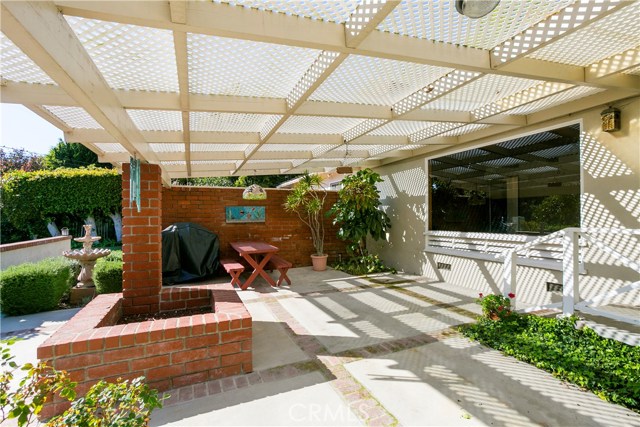 A spacious covered patio off the living room offers great entertaining space and outdoor dining.