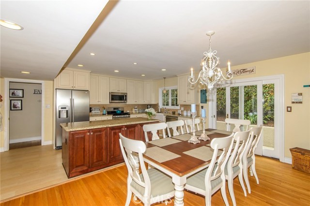 Open kitchen concept with formal dining area Open kitchen concept with formal dining area