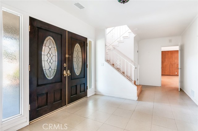 Double door entry with sidelites into foyer.