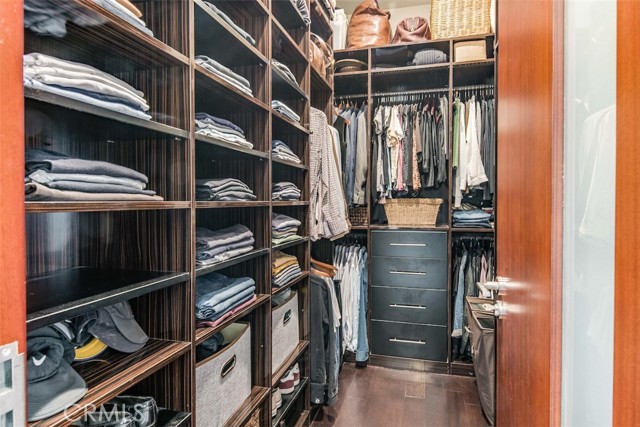 Walk-in closet with built ins in the Primary Bedroom.