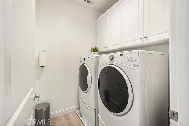 Upstairs Laundry Room with Built-In Cabinetry