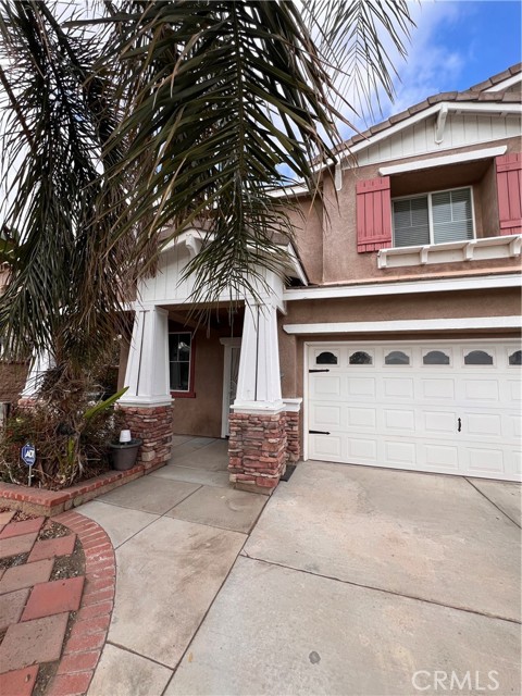 Front of home - 3 car garage with large fully gated driveway