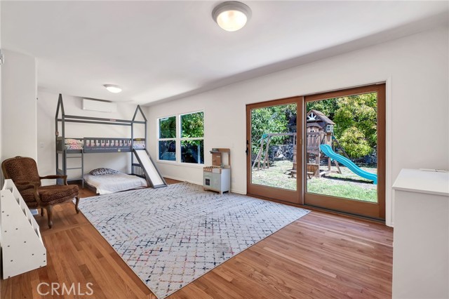 bedroom towards back of house with access to backyard (Appears to have been two rooms before)