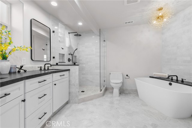 The spa-like bath is a relaxing retreat with gorgeously styled features.