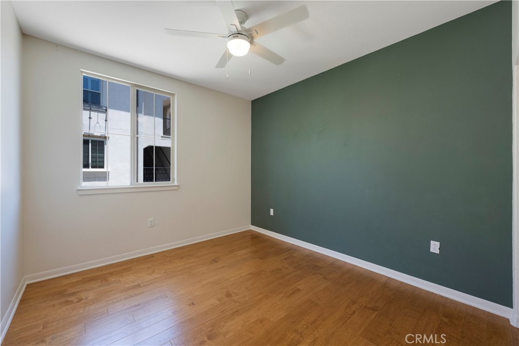 Bedroom #2 has Real Hardwood Flooring, Ceiling Fan, and Dual Paned Windows!