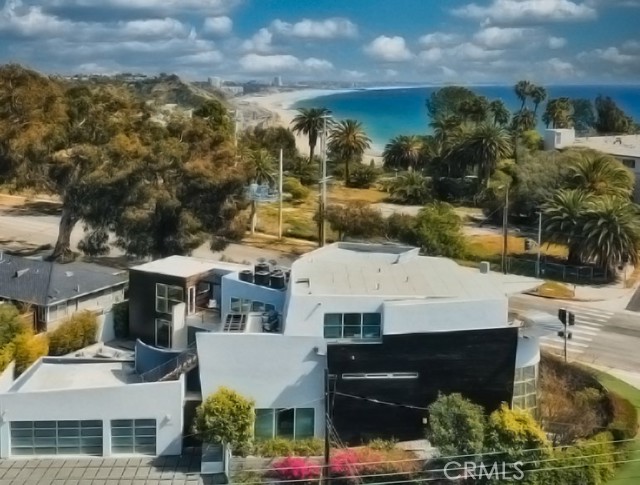 16988 W Marquez Boulevard Pacific Palisades, California A stunningly designed family home right on the glittering oceanfront! Incredibly spacious and flooded with natural light from the tasteful glass and steel walls throughout. There is a beautiful private courtyard for entertaining, a lovely gourmet kitchen with red, wooden, and steel accents, a theater and game area nestled into the lower floor, and comfortable, bright bedrooms upstairs with wonderful views of the ocean. Additionally, there is an exercise room, sauna room, three car garage, and so many more wonderful attributes! Just nearby the estate offers the entertainment from restaurants and shopping throughout Palisades Village!