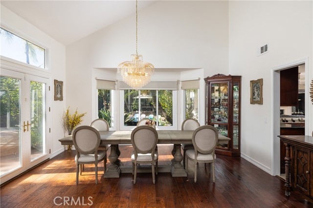 Elegant dining room space overlooks the outdoor oasis.