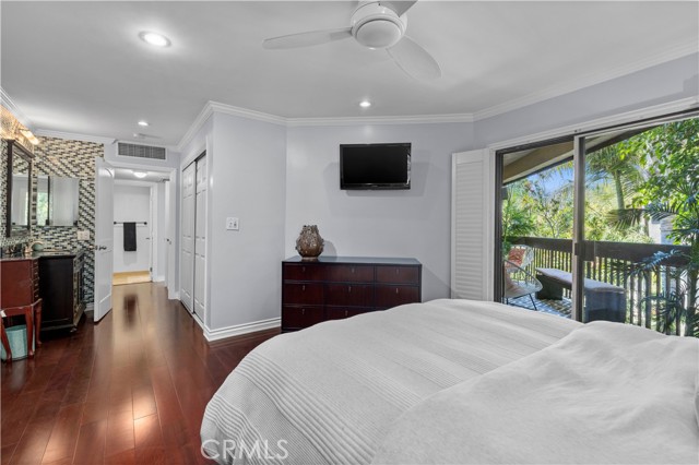 Beautiful views of trees and deck from the bedroom.