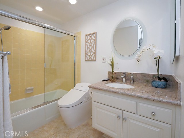 Hallway guest bathroom with bidet toilet