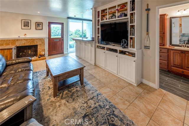 Living area with custom built-ins and fireplace.