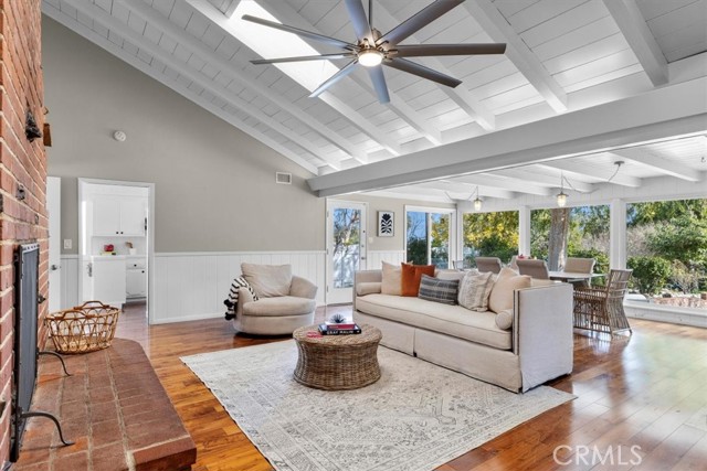 Family room opens to the dining room with tons of natural light and features vaulted  ceilings.