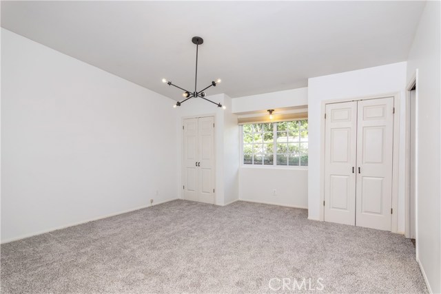 Master bedroom with three closets.