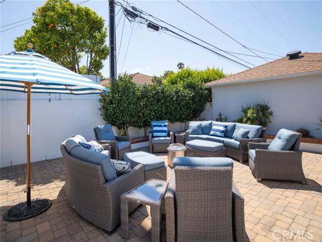 Enjoy the low maintenance backyard with pavers and lots of sun!