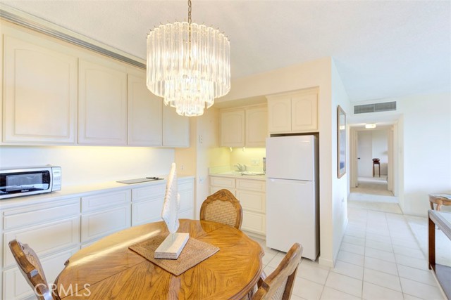 KITCHEN AREA FEATURING 2 BURNER COOK TOP, TONES OF COUNTER SPACE AND SINK AREA-- FRIG IS INCLUDED IN SALE