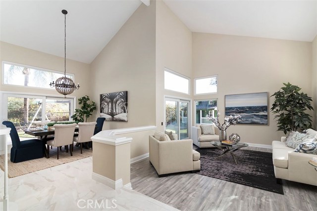 1901 Rushmore N Orange, California Located in the heart of beautiful Orange County, this Maybury Ranch 4 Bedroom, 3 Bathroom traditional home is tastefully upgraded and beautifully designed. A formal stone walkway and fresh landscaping creates a formal entrance. This expansive floor plan offers a formal living room, dining room, and spacious downstairs bedroom perfect for guests. Elegant chandeliers, tastefully upgraded flooring, high ceilings, plantation shutters, and wall to wall windows allow for plenty of natural sunlight. A chef enthusiast can take pride in state of the art kitchen with built in range, granite countertops, stainless steel appliances, and center island. Lounge in family room next to fireplace with marble accents and backyard views. Host and entertain in a backyard oasis featuring an underground private pool, impressive jacuzzi, serene waterfall, and towering palm trees. Spiral staircase leads to additional upstairs bedrooms and a large Master Suite. Master bath features spa like amenities - soaking tub, walk-in glass shower with custom tiling, dual sinks, and his/her closets. Home is located next to beautiful nature preserves, nearby freeway entrances, exceptional schools, and first-class dining/shopping destinations.