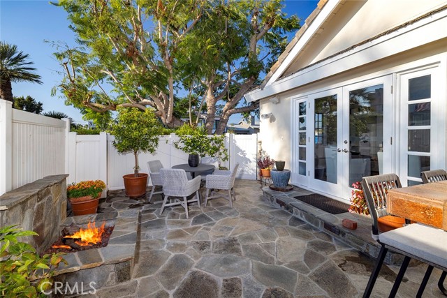 Great trees and lush plants surround the home.