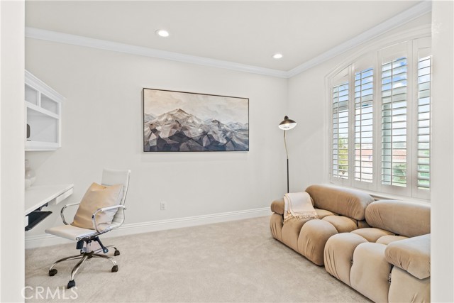 Second floor den with built-in desk and book shelf.