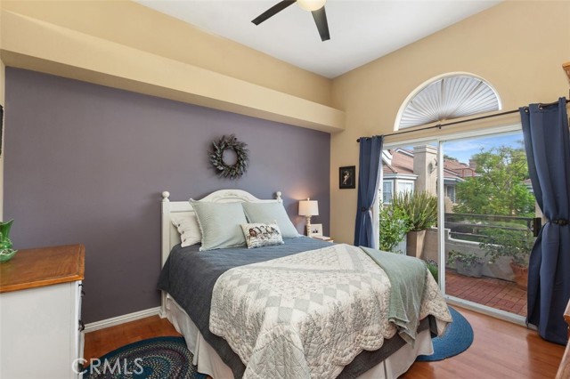 Primary bedroom with slider doors that open onto the private patio.