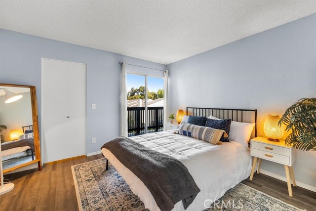 Spacious bedroom with walk in closet and balcony access