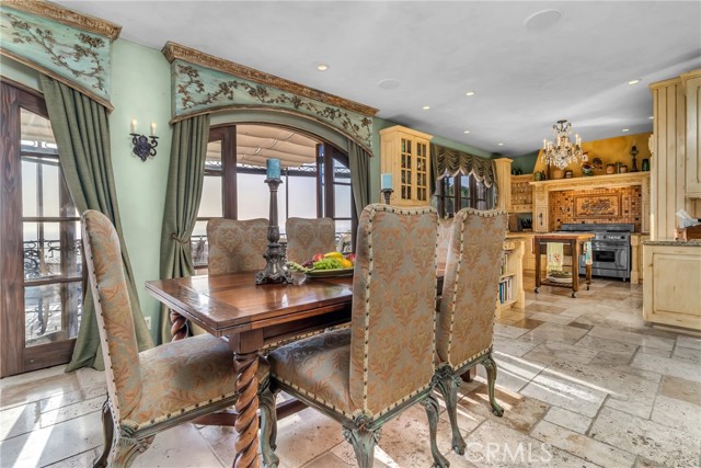 Informal dining area between family room and kitchen with French doors leading outside.