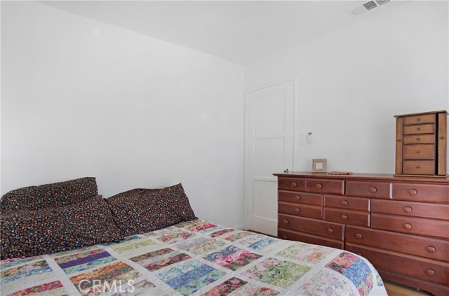 Primary bedroom also has direct access to covered patio and yard