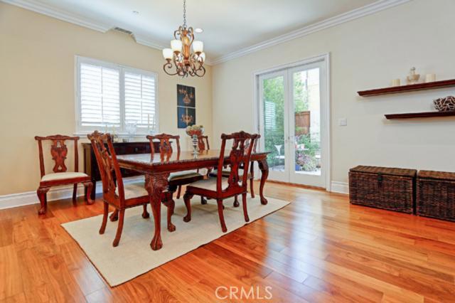 Lovely dining room with glass french doors leading to the patio and yard. Lovely dining room with glass french doors leading to the patio and yard.