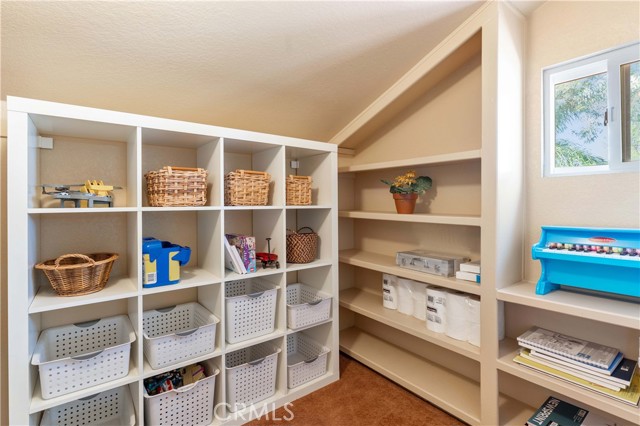 Walk in closet of one of the bedrooms upstairs.