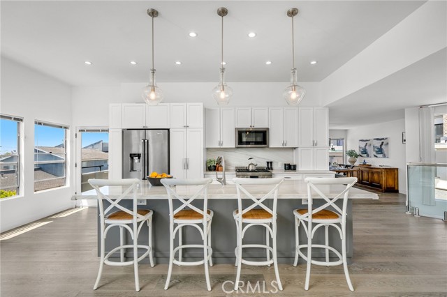 Updated kitchen with modern finishes at 647 1st Place. Updated kitchen with modern finishes at 647 1st Place.