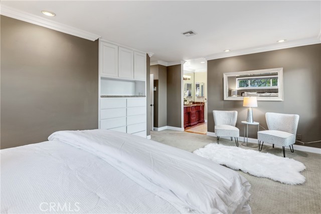  The suite includes a large walk-in closet and an elegant en-suite bath.