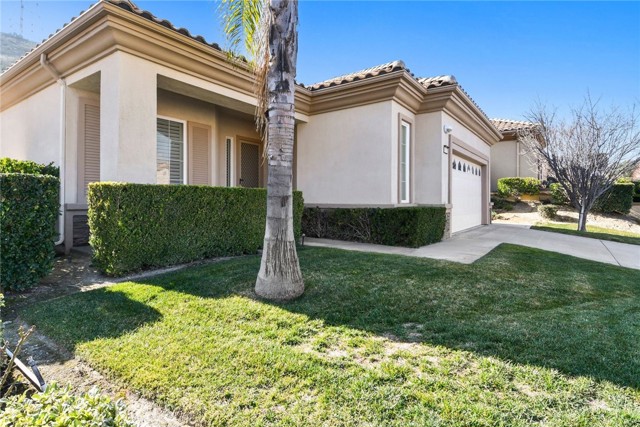 5291 Breckenridge Avenue Banning, California Beautiful 2 bedroom, 2 bathroom, single story home with mountain views in the gated community of Sun Lakes Country Club in Banning! Enjoy an open floor plan, plantation shutters, and an inviting fireplace in the family room. The kitchen offers corian countertops, a walk-in pantry, and a breakfast bar that opens to the family room and breakfast nook. The primary bedroom features a walk-in closet, dual sinks in the primary bathroom, a walk-in shower, and a soaking tub. Sliding doors lead to the covered outdoor patio and back yard. Additional property highlights include a bonus room, a laundry room with a sink, and a 2 car garage. Community amenities include a swimming pool, spa, a picnic area, a golf course, tennis courts, a gym, and a clubhouse. Convenient to local schools, area parks, shopping, and easy access to freeways!