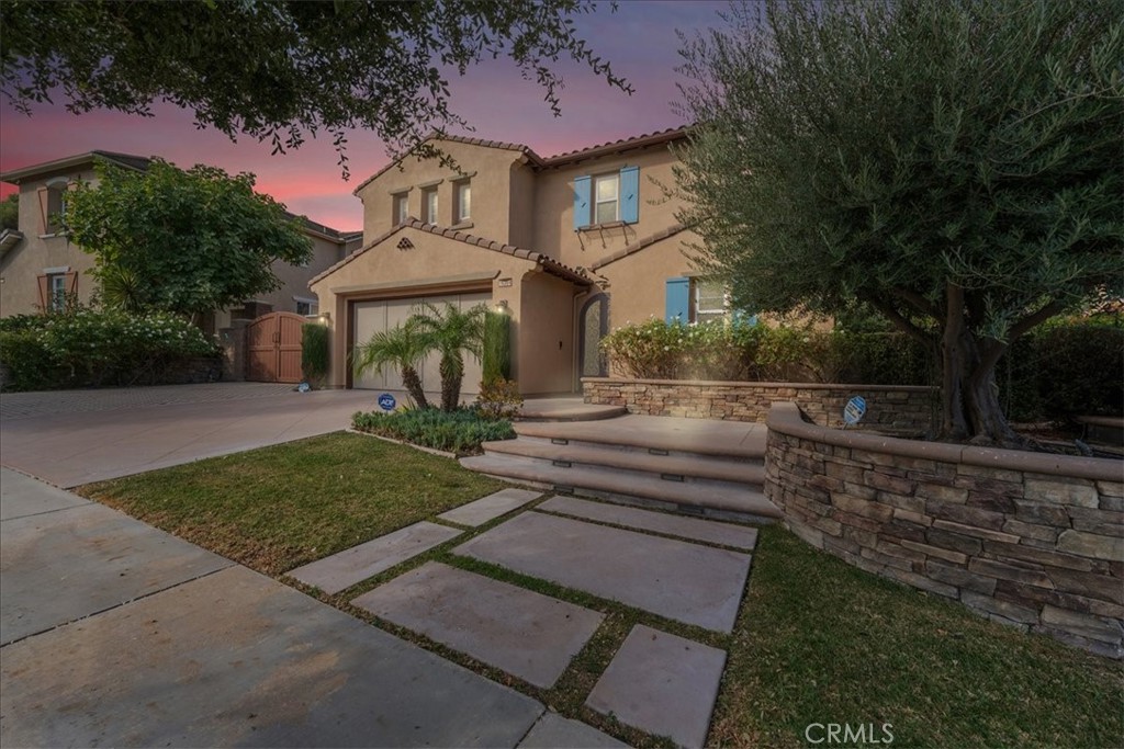 Welcome to a tranquil retreat in the sought-after gated community of Ridgegate in Chino Hills. This peaceful home is uniquely positioned on a spacious lot with no neighbors behind, offering a private and serene atmosphere. The beautifully landscaped backyard features a sparkling pool, relaxing spa, and a large covered patio area, perfect for enjoying outdoor living in your own secluded paradise. Inside, the home greets you with an elegant courtyard entry that leads to a refined interior, complete with a detached bedroom that offers flexible use as a guest suite, office, or private studio. The open layout flows effortlessly, with light-filled spaces that highlight the warm tones and custom finishes throughout. Experience the charm and privacy of this understated residence, perfectly designed for those seeking a serene lifestyle in Chino Hills' exclusive Ridgegate community. (Solar Panels is paid off and is included with the Sale)
