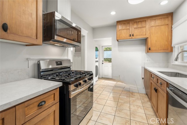 Ample counter space. Custom cabinets with classic finishes. Drawers pull out inside the cabinets.