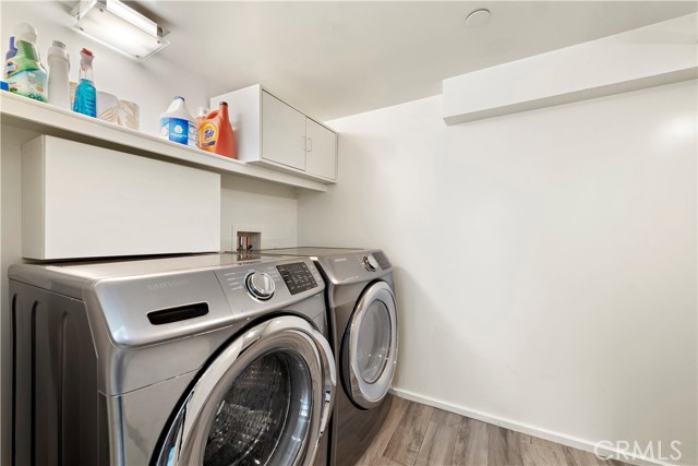 Utility room with extra storage located off of kitchen