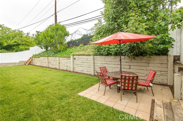Open and grassy rear yard with upper level batting cage area... Open and grassy rear yard with upper level batting cage area...