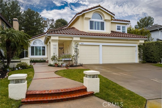 Welcome to 937 S. Barton Court, a stunning 5 bedroom, 4 bath residence nestled in the highly sought after Summit Springs community in Anaheim Hills. This professionally designed freshly painted exterior and interior home ideally located on a quiet cul-de-sac spans across 2863 square feet of living space on a spacious 9424 square foot lot. Enjoy the colorful garden walk approach as you enter through double doors into the spacious foyer with soaring ceilings over an elegant formal living room punctuated with a beautiful Boston Steinway piano adjacent to a formal dining room featuring French doors that open to the gorgeous back yard. The charming kitchen which opens to a spacious family room, boasts top of the line Thermador oven, DCS stove top, custom cabinetry with lighted pantry shelves and white tile counter top center island all overlooking the family room with beautiful fireplace and floor to ceiling custom built in cabinetry. Step through the sliding glass door onto a patio and entertainers dream with a gas fire-pit, new built in BBQ island overlooking a plethora of professional mature landscaping surrounding the breathtaking pebble tec bottom pool with an in floor pop up cleaning system, Aqua link App Control, new pool tile and coping and new pool equipment all providing peace and relaxation. The main floor spacious bedroom and bathroom provides convenience for one level living, guests, or multi-generation living. Completing the first level is an interior laundry room with sink for added convenience. The second level has 4 additional bedrooms each offering comfort and privacy with ample cabinets for storage in the hallway. The spacious primary suite overlooking the back yard is a retreat in itself which includes a sitting area, fireplace, a jet bath tub with separate shower, storage, skylight, porcelain tile flooring, and walk in closet. One bedroom is currently used as a professional office to a Jack and Jill third bedroom with full bath in between. The 4th bedroom is a beautiful en suite bedroom with large windows. This home has Simonton Windows installed throughout with the lifetime warranty transferring to the new owners. Additional features is a surround sound system, security alarm system, ceiling fans throughout the home and 3 car garage with overhead storage and lighting. The ideal location near award winning schools, restaurants, and shopping makes 937 S. Barton Court an opportunity to experience elevated living in Anaheim Hills.