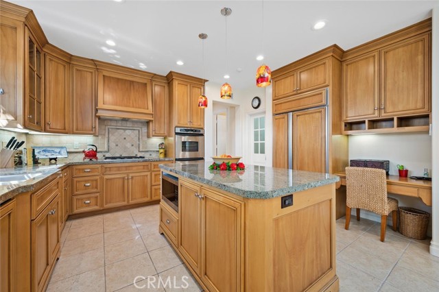 Kitchen is beautiful with double ovens, SubZero fridge, large pantry room.