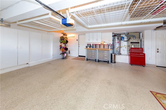 Garage with abundant storage cabinets