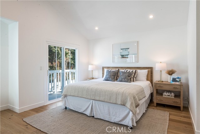 Primary bedroom with fireplace and private deck