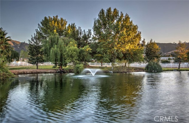 Welcome to Hawk Ranch – a truly exceptional 40-acre ranch estate and turnkey event venue located on Murrieta’s prestigious westside. Zoned Rural Residential (RR) with a fully approved Minor Conditional Use Permit (MCUP) for weddings and events, this rare property blends luxury living, thriving agri-tourism businesses, and substantial income opportunities. Just minutes from I-15, I-215, and the renowned Temecula Valley Wine Country, Hawk Ranch offers privacy, scale, and accessibility in one of Southern California’s most sought-after rural communities.

The estate features five separate residences totaling approximately 13,500 square feet. At the heart of the property is a ±7,300 SF custom main residence designed in a lodge style with impressive natural wood interior finishes, vaulted ceilings, and  a beautifully landscaped yard and pool ideal for entertaining. Four additional homes—ranging from 950 to 2,500 SF—are ideal for guest housing, potential short-term vacation rentals or B&B operations.

A ±2,300 SF banquet/gallery hall anchors the wedding and events business, complemented by beautifully landscaped ceremony lawns, tree-lined reception areas, bride and groom suites, and a tranquil 1/3-acre pond stocked with fish and accented by a central fountain. Business operations include weddings and receptions, private farm animal tours, cattle and farm product sales, a souvenir retail shop, and residential rental income.

Projected net annual income exceeds $450,000, with $200,000 from weddings and events, $150,000 from rentals, and $100,000 from agri-tourism operations. All ranch and farming equipment is included, offering a seamless transition for the next owner-operator.

Originally developed by builder and outdoorsman William Mitchell as a private retreat, the property was granted a CUP in 2014 and has since been thoughtfully expanded by the current owners to support a wide range of uses and revenue streams. Additional features include a 5-car garage, 60-foot-deep RV garage, two operational water wells, multiple septic systems, and a 5/8-mile horse racing track.

One of only four permitted wedding venues in Murrieta, Hawk Ranch presents an unparalleled opportunity for investors, retreat operators, hospitality entrepreneurs, or multi-generational buyers seeking a lifestyle asset with income, history, and growth potential.

Shown by appointment only. Do not disturb active business operations.