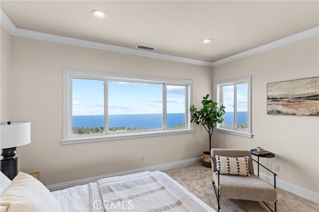 Ocean view guest room with en-suite bathroom.