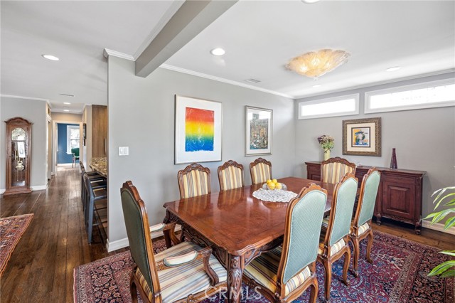 From the formal dining room to the open remodeled kitchen and adjoining living spaces.